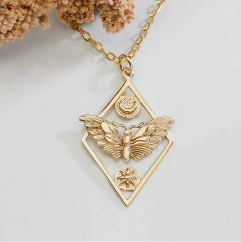 Geometric moth necklace with sun and moon. Comes on a simple gold fill 18