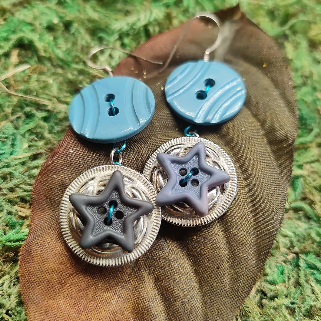 Blue button star earrings.
