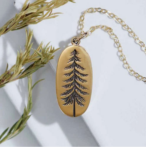 This 18 inch oval pine tree charm necklace features one of the most majestic trees of all time. The charm measures 22x10mm, excluding jumprings. Bronze charm on Gold filled chain. 