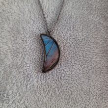Load image into Gallery viewer, Blue Morpho Crescent Moon Necklace  Materials:  Glass  All necklaces are nickel-free, brass core with a gunmetal finish  Focal metal is lead-free, nickel-free blend of silver and tin  Cruelty free, responsibly sourced butterfly wings
