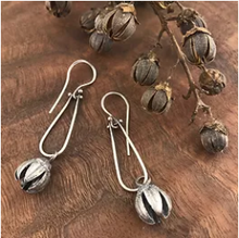 Load image into Gallery viewer, The seed pods of the crepe myrtle are also stunning; split open, they resemble little flowers themselves. Personally, I love the seed pods as much as the flowers!     I cast a crepe myrtle seed pod in sterling silver and hung it from sterling silver hinged loops. The addition of the hinges gives these earrings great movement. These earrings are eye-catching but easy and comfortable to wear.
