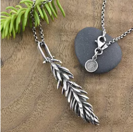 A sprig of sedum is cast in sterling silver and hangs from a hinged bail on a chunky sterling silver rolo chain.  I think of sedums as Nature’s adornment; the variety of foliage shapes and textures make them seem like living art. They are some of my favorite succulents because of their vibrancy and geometric shapes.  Details: Material: recycled sterling silver Finish: oxidized Pendant Length: 2 1/2” Chain: 30” sterling silver rolo chain