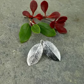 The striking angularity of these leaves makes them perfect for earrings.The Myrtlewood is a tree that goes by many names, but it thrives in only one area—the beautiful coastal forests of the Pacific Northwest. One of its names—the California bay—hints at just how much these leaves resemble culinary bay leaves. But fresh Myrtlewood leaves have a peppery aroma all their own and were often used by Native American tribes as medicine.Details:Material: recycled sterling silverFinish: oxidized or bright