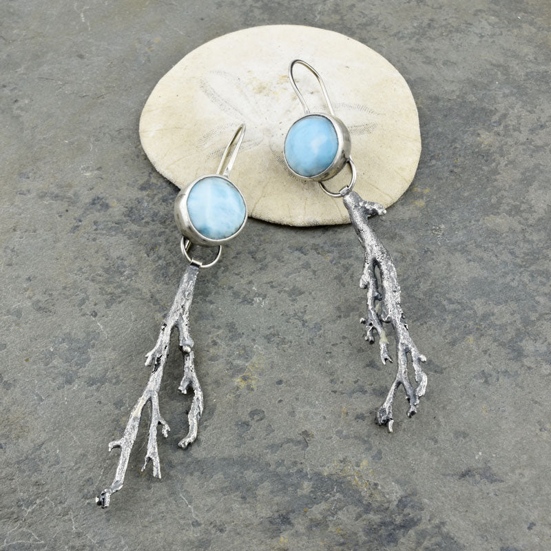 These earrings embody the calm drift of ocean current. The blue and white swirl of the larimar stones reminds me of a sea foam swell. Beneath the surface, fronds of seaweed gently undulate.  These earrings pair beautifully with the larimar and seaweed necklace. recycled sterling silver