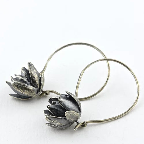 I think of succulents as Nature’s adornment; the variety of foliage shape and texture makes them seem like living art.      I cast these succulents in silver and attached them to silver hoops. The wire clasp keeps the earrings comfortable and worry-free. I love these earrings because they can be dressed up or down—simple enough for everyday but interesting enough to add a little intrigue. 