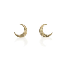 Load image into Gallery viewer, Tiny Crescent studs are perfect for everyday wear. Gold moons with crater/moon texture. Standard post &amp; nut, all 14k gold. Tiny Crescent Stud, 7mm tall third photo shows sizes of moon studs, Tiny Crescent Stud is in center Handmade in Colorado using responsibly sourced materials.
