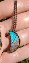 Load image into Gallery viewer, Blue Morpho Crescent Moon Necklace Materials: Glass All necklaces are nickel-free, brass core with a gunmetal finish Focal metal is lead-free, nickel-free blend of silver and tin Cruelty free, responsibly sourced butterfly wings
