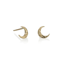 Load image into Gallery viewer, Tiny Crescent studs are perfect for everyday wear. Gold moons with crater/moon texture. Standard post &amp; nut, all 14k gold. Tiny Crescent Stud, 7mm tall third photo shows sizes of moon studs, Tiny Crescent Stud is in center Handmade in Colorado using responsibly sourced materials.
