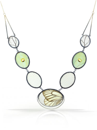Set between two layers of polycarbonate and framed in oxidized sterling silver: luna moth wings, snakeskin, and leaf skeletons.  Handmade in Northern California with sustainable materials.Unique gift for her for anniversary, birthday or Valentine's Day. Chester Springs, PA. 