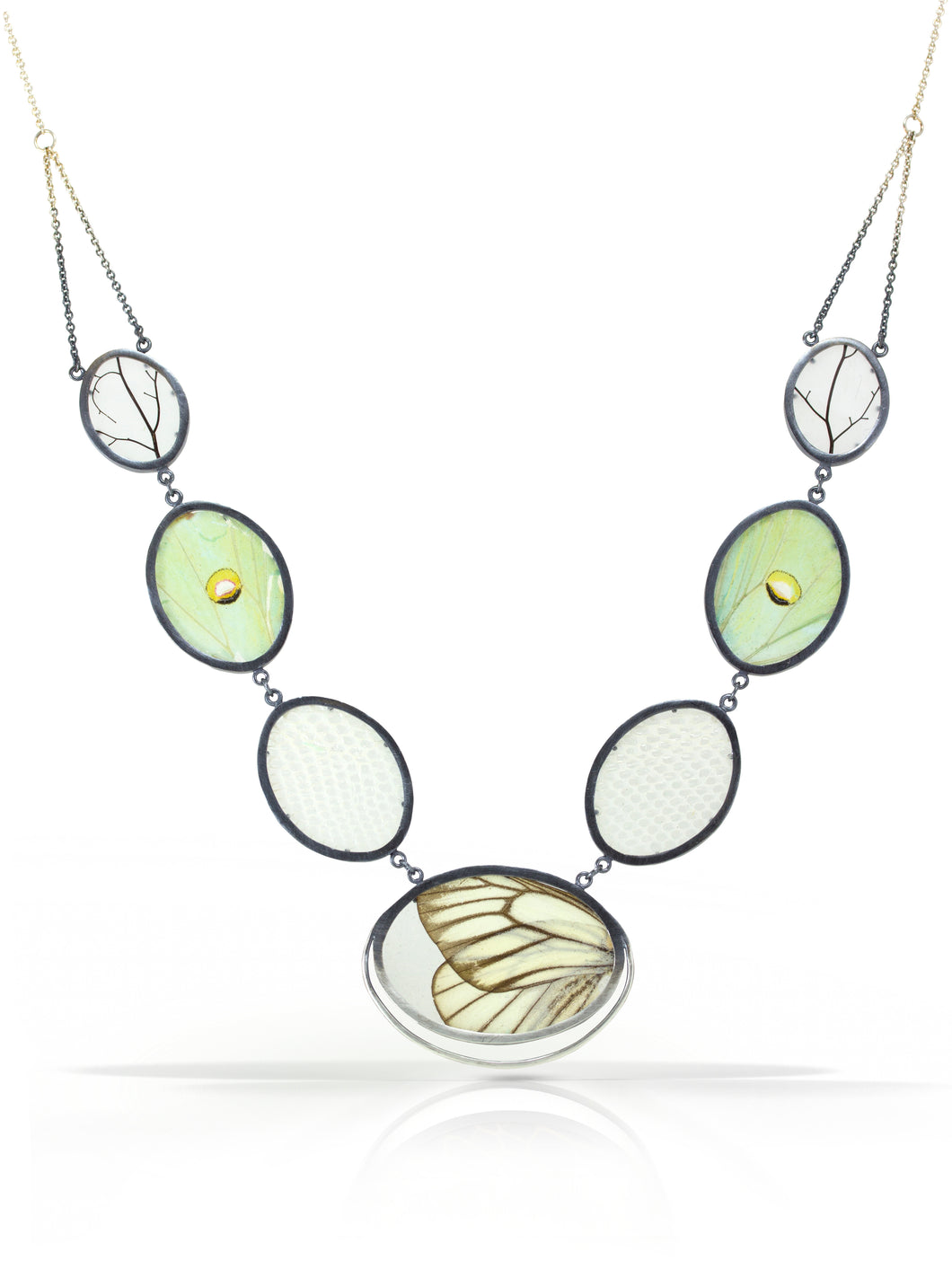 Set between two layers of polycarbonate and framed in oxidized sterling silver: luna moth wings, snakeskin, and leaf skeletons.  Handmade in Northern California with sustainable materials.Unique gift for her for anniversary, birthday or Valentine's Day. Chester Springs, PA. 