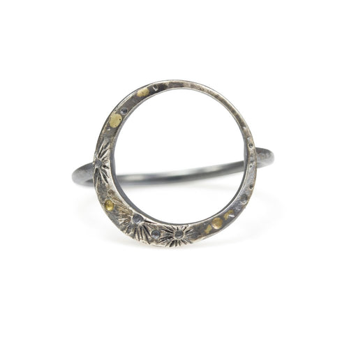 A lyrical moon with 18k details wraps perfectly around the finger to keep the moon close to you every day. Textured with tiny craters and details, this ring will help you wander about the stars.  • Solid sterling silver ring • 18k yellow gold details  Moon is 5/8” Ring is just over 1/2” at tallest point.  This ring is made to order, please allow 2-3 weeks for it to be built to your exact size.  Made in Colorado with carefully sourced materials, including recycled silver.