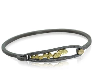 Elongated Pond Bracelet features our hinged loop clasp, which swings up for sliding into, then down to lock into place.   Hand fabricated in textured oxidized sterling silver and 18k yellow gold --with an 18k gold pebble on the hook.   Metals: Oxidized sterling silver and 18k yellow gold Bracelet dimensions: W x 14.7mm L