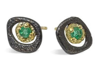 Load image into Gallery viewer, Inspired by nature, these grass green emerald studs are the perfect pair to wear everyday!  Metals: Oxidized sterling silver and 18k yellow gold Stones: Emerald  (0.15ct) Dimensions: 7mm x 8mm
