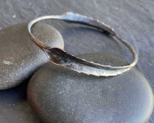 This bangle features two mother of thousands leaves cast in sterling silver. The leaves have amazing texture and an absolutely unique appearance.  Details: Materials: recycled sterling silver Finish: oxidized