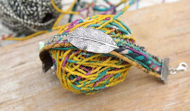 These beauties are made with recycled Sari Silk and Hemp Ribbons in various colors which blend together for a whimsical addition to your bracelet stack!  The leaf is a Sterling Silver handmade charm and complements the Sterling Silver end connectors that are also handmade and attach to a 2