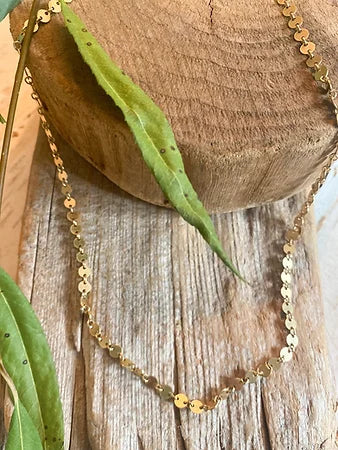 This is a great chain for layering with other Woods and Willow Charm Necklaces or with necklaces in your personal treasure trove!  It is 14kt Gold Filled and consists of shiny round discs that feel like velvet against your neck.   It is available in FOUR lengths making it custom to your layering needs!