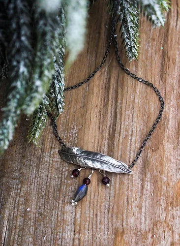 This leaf necklace design showcases this symbolic leaf that represents flexibility when dealing with life's challenges.  It is horizontally oriented and the actual Willow leaf charm is about 1 1/2