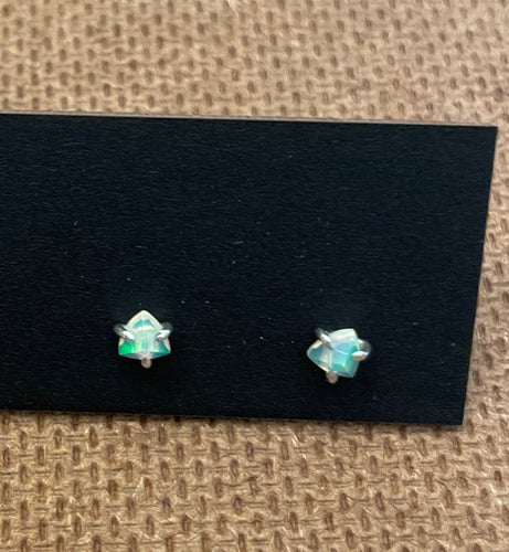 Welo Opal Studs (SS)  The fire in these Welo opals is intense! Trillion cut opals are set in handmade sterling silver  They are very dainty, measuring 4 mm wide.