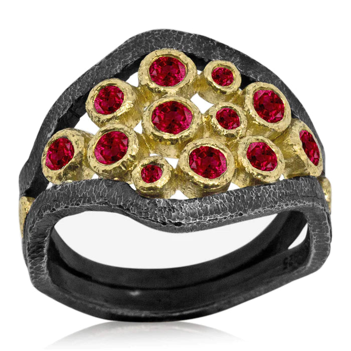 The Mountain Stream Cluster Ring is reminiscent of rushing streams sparkling in the summer sun.   Metals: Oxidized sterling silver and 18k yellow gold  Size: 8  Stones: Rubies (1.06ct)